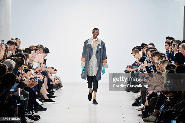 Model walks the runway at the Agi & Sam Spring Summer 2017 fashion show during London Menswear Fashion Week on June 11, 2016 in London, United...