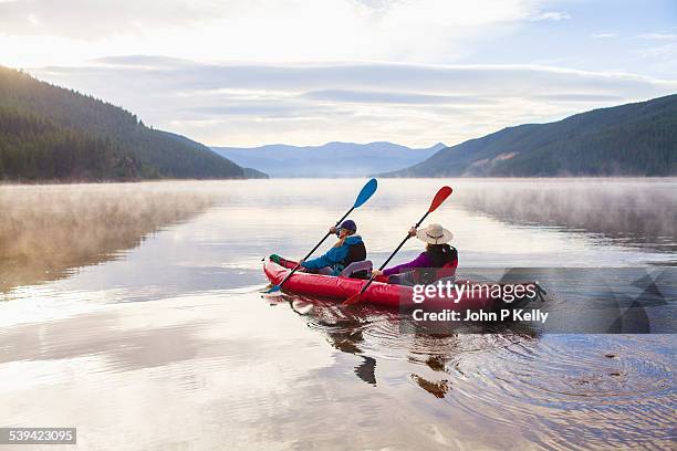 early morning kayaking - family red canoe stock pictures, royalty-free photos & images