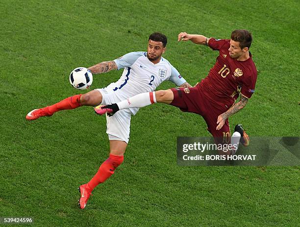 England's defender Kyle Walker vies with Russia's forward Fedor Smolov during the Euro 2016 group B football match between England and Russia at the...