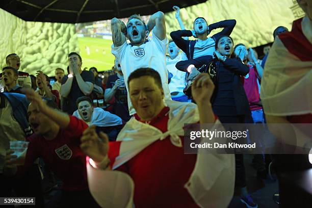 England fans react while watching the England v Russia game at the Hyundai fan-zone on June 11, 2016 in London, England. While many football fans...