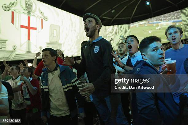 England fans react while watching the England v Russia game at the Hyundai fan-zone on June 11, 2016 in London, England. While many football fans...