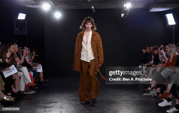 Model walks the runway at the Alex Mullins Salon show during The London Collections Men SS17 at BFC Presentation Space on June 11, 2016 in London,...
