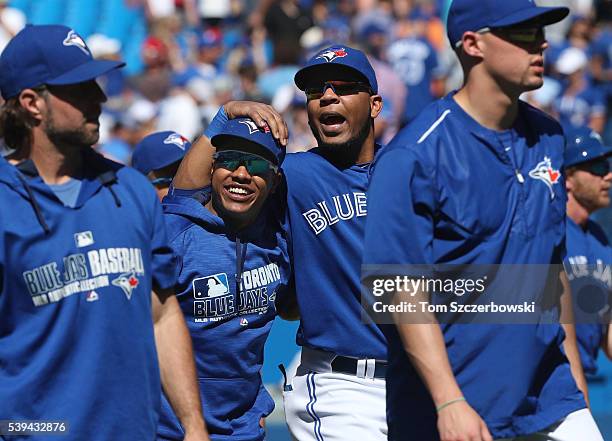 Edwin Encarnacion of the Toronto Blue Jays celebrates their victory with Marcus Stroman during MLB game action against the Baltimore Orioles on June...