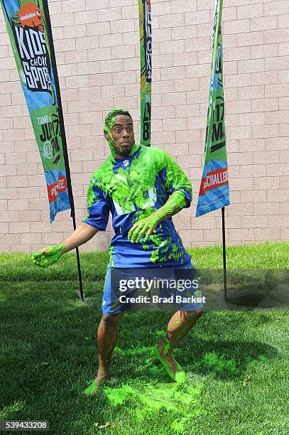 New York Girant Rashad JenningsÊgets slimed at the Nickelodeon And The New York Giants Host Tryouts For The "Triple Shot Challenge: Kids' Choice...