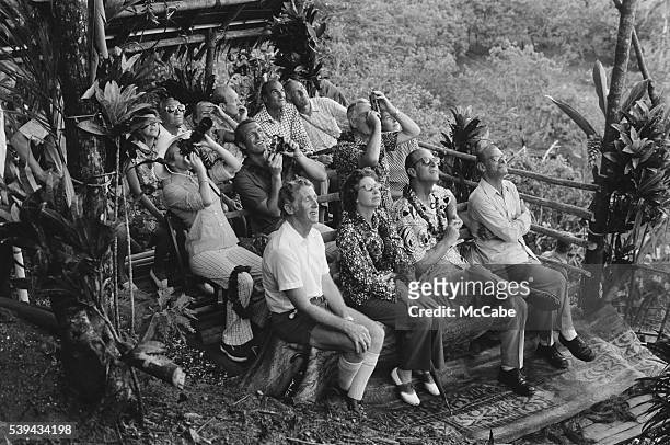 Members of the British royal family watching a display of land-diving from a bamboo tower during a visit by to Pentecost Island, Vanuatu, off the...