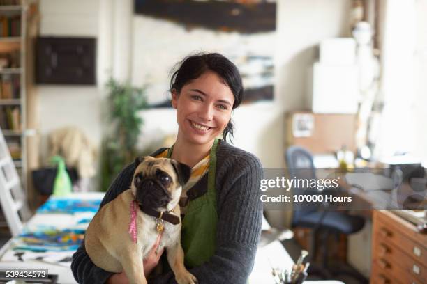 portrait of a young artist in her studio - pug portrait stock pictures, royalty-free photos & images
