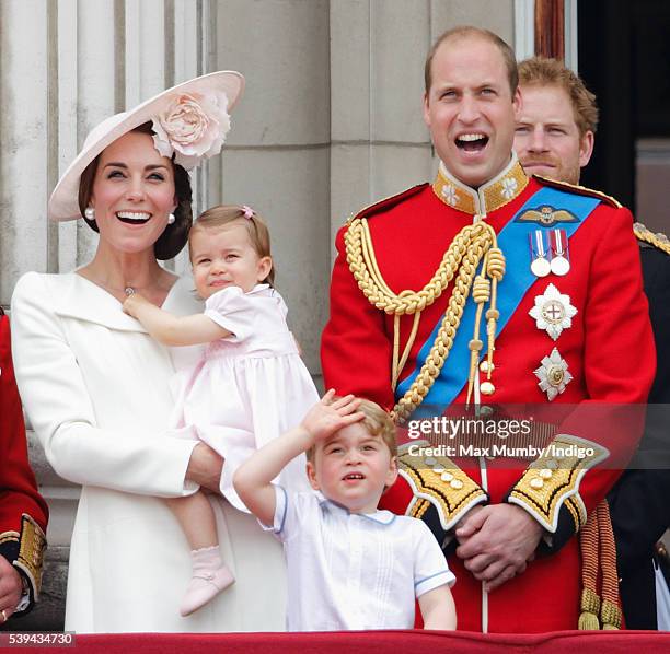 Catherine, Duchess of Cambridge, Princess Charlotte of Cambridge, Prince George of Cambridge and Prince William, Duke of Cambridge watch the flypast...