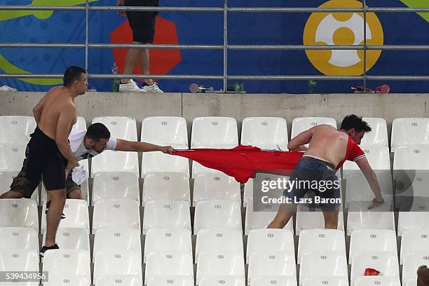 Fans clash after the UEFA EURO 2016 Group B match between England and Russia at Stade Velodrome on June 11, 2016 in Marseille, France.