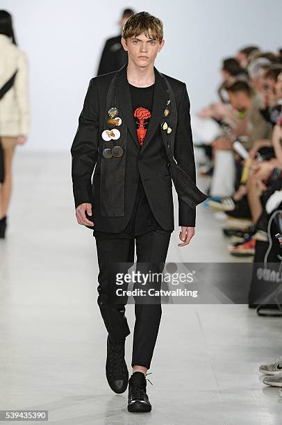 Model walks the runway at the Matthew Miller Spring Summer 2017 fashion show during London Menswear Fashion Week on June 11, 2016 in London, United...