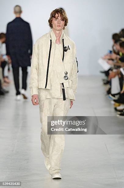 Model walks the runway at the Matthew Miller Spring Summer 2017 fashion show during London Menswear Fashion Week on June 11, 2016 in London, United...