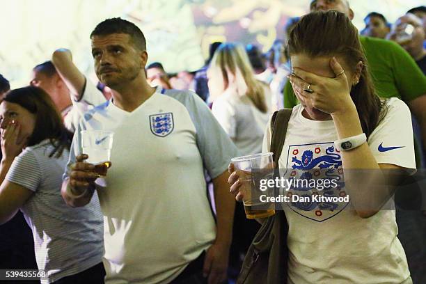 England fans react as Russia score an equalizer while watching the England v Russia game at the Hyundai fan-zone on June 11, 2016 in London, England....