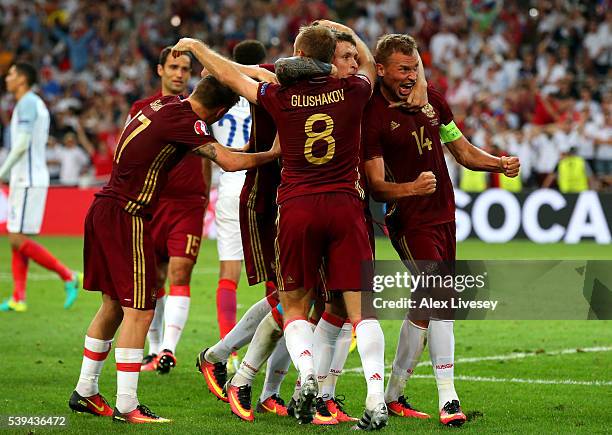 Vasili Berezutski of Russia celebrates scoring his team's first goal with his team mates during the UEFA EURO 2016 Group B match between England and...