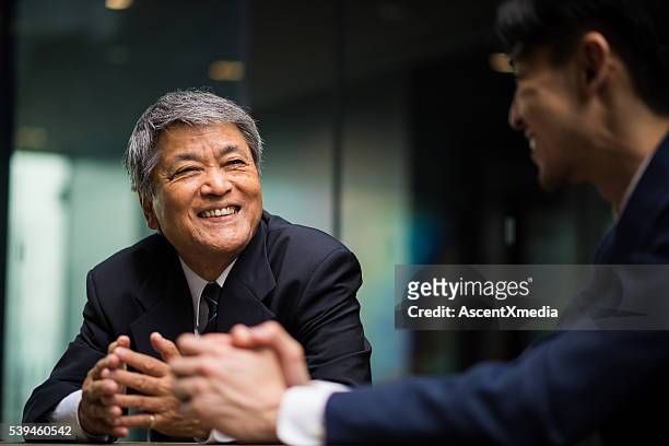 senior business mentor - japanese old man stock-fotos und bilder