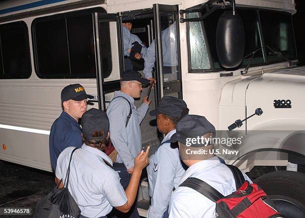 Navy medical personnel board buses at the Naval Air Station September 1, 2005 in Jacksonville, Florida. The sailors will travel to Pensacola, where...