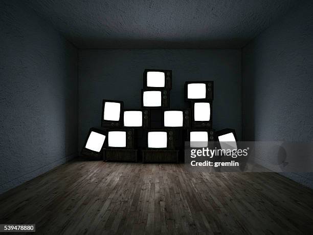 empty room of a group of tv sets - tv on wall stockfoto's en -beelden