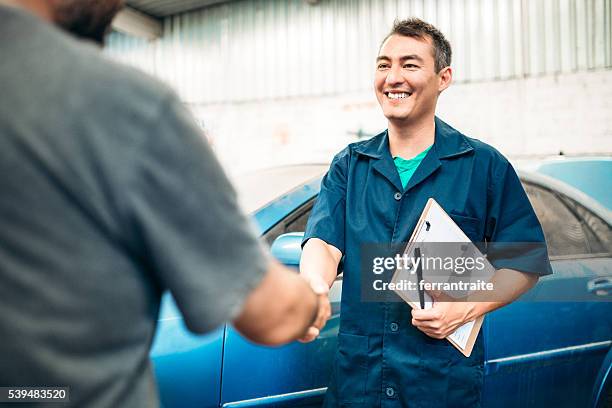 car mechanic handshakes customer - conversation car bildbanksfoton och bilder