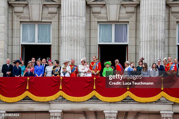 The Royal Family stand on the balcony during the Trooping the Colour, this year marking the Queen's official 90th birthday at The Mall on June 11,...