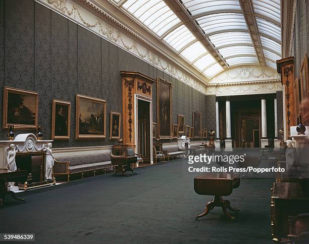 View of the interior of the Picture Gallery at Buckingham Palace, created by the architect John Nash, with a display of paintings from the Royal...