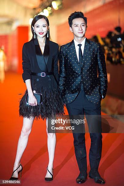 Actress Tang Yan and singer Han Geng walk the red carpet of the 19th Shanghai International Film Festival at Shanghai Grand Theatre on June 11, 2016...