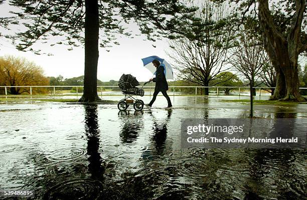 Michelle Rawson of Botany taking her baby daughter Emilee for a walk through Centennial Park where heavy rains have bought relief to the coastal...