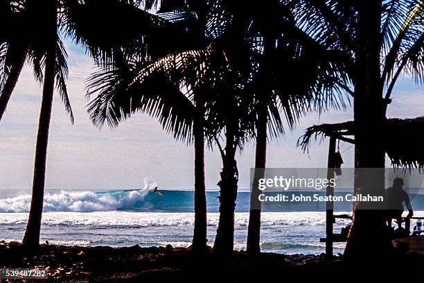 surfing in the hinako islands - hinako islands stock pictures, royalty-free photos & images