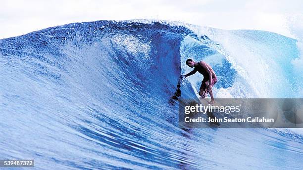 surfing in the hinako islands - hinako islands stock pictures, royalty-free photos & images