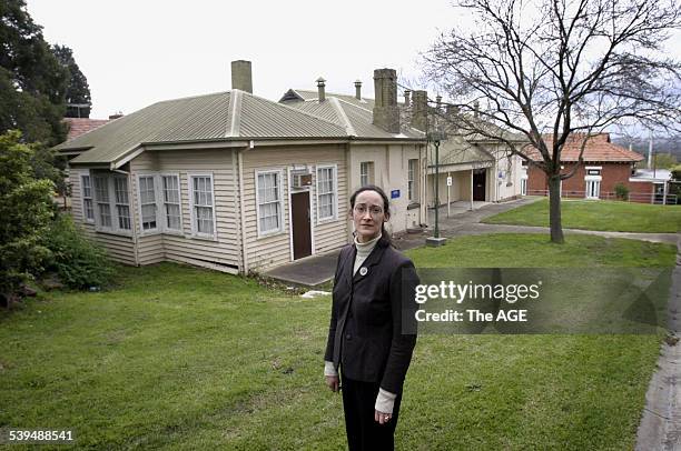 Louise Godwin in front of one of the buildings at Kew Cottages that she is hoping to have heritage listed. Taken 22 August 2004. THE AGE NEWS Picture...