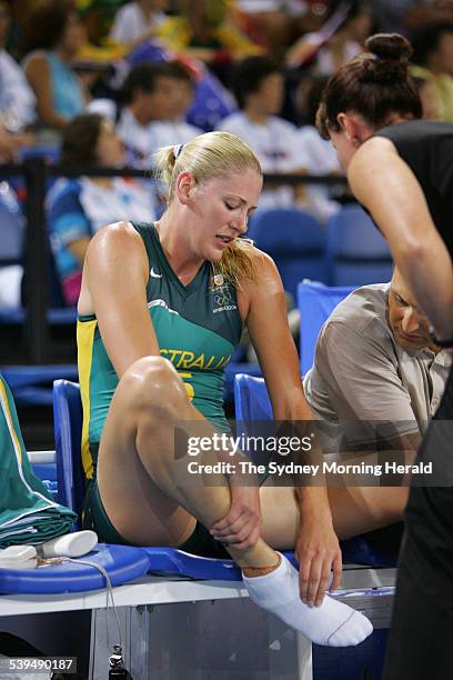 Australian basketball player Lauren Jackson nursing a foot injury during an Olympic Games match against Brazil at the Helliniko Indoor Arena in...