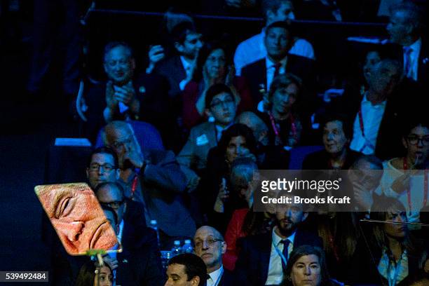 His face reflected in a teleprompter, Republican presidential candidate Donald Trump addresses the annual policy conference of the American Israel...