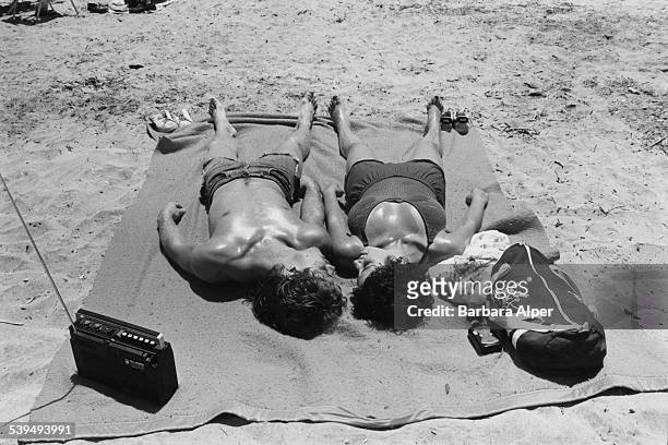 Sunbathers on Rockaway Beach, on the Rockaway Peninsula in Queens, New York City, 3rd July 1982.