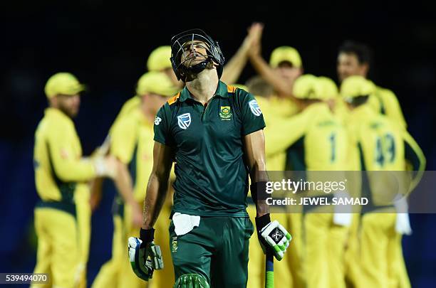 South African cricketer Faf du Plessis reacts as he leaves teh field after being dismissed by Australian bowler Mitchell Starc during their...