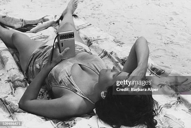 Woman sunbathing on Rockaway Beach, on the Rockaway Peninsula in Queens, New York City, July 1982.