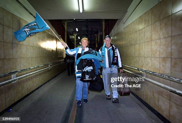 Port Adelaide fans arrive on the train tonight at Spencer St ahead of Saturday's Grand Final against Brisbane - Joan and John Waller show their...