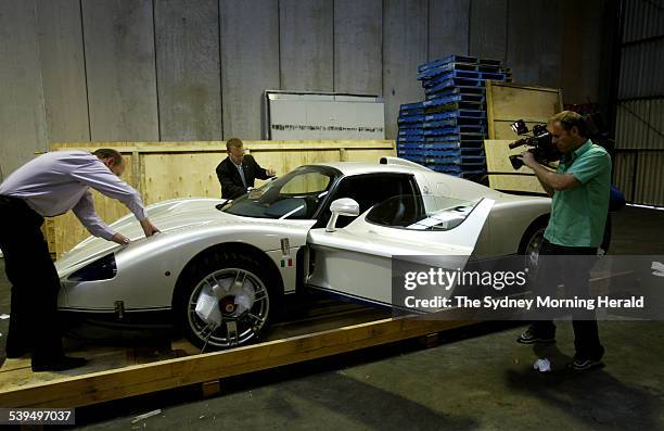 The road-going version of Maserati s MC12 which reaches a top speed of 330km/h being uncrated and unwrapped 27 September 2004. SMH Picture by PETER...