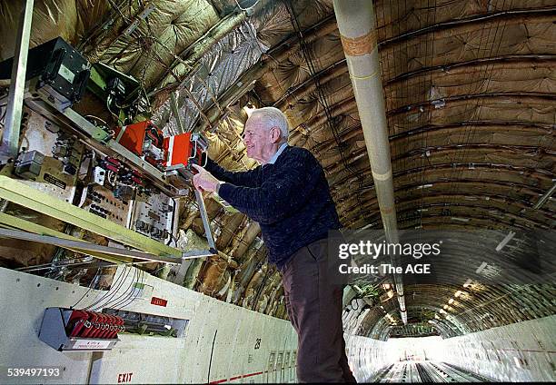 Dr David Warren, inventor of the Black Box flight recorder, checks one of the devices on a 747 cargo plane at Melbourne Airport, 26 August 1998. THE...