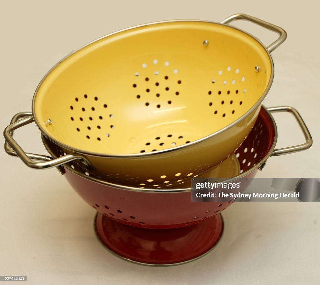 Red and yellow kitchen colanders, 16 September 2004 SMH Picture by QUENTIN JONE