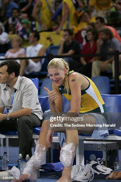 Lauren Jackson receives treatment and ice to her ankles and shins - then lets the photographers know shes ok during the Australia vs Greece womens...