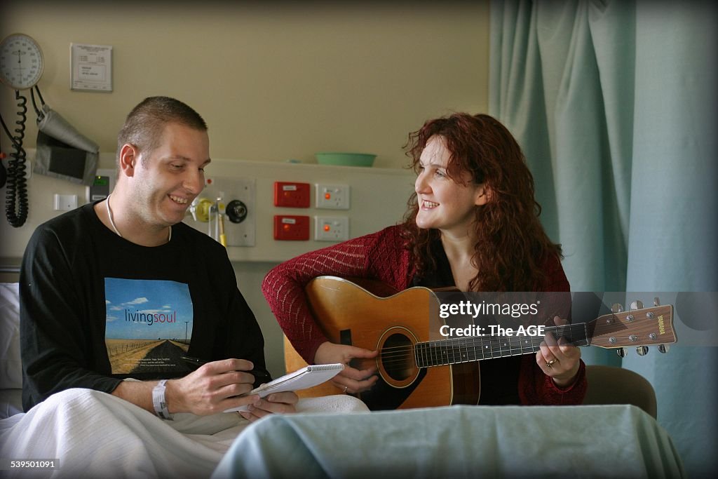 Music therapist Emma O'Brien with Justin Bakkum at the Royal Melbourne Hospital.