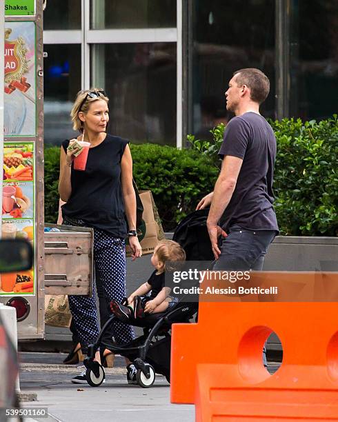 Sam Worthington with Lara Bingle and their baby Rocket Zot are seen buying fruit shakes from a street vendor in TriBeCa on June 11, 2016 in New York,...