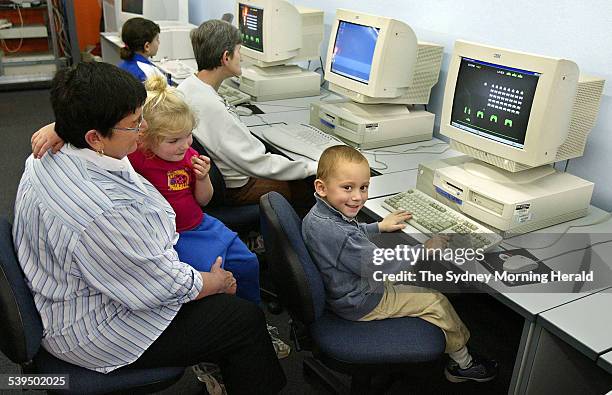 Helen Daniels sits at the Woolloomooloo centre with her grandchildren Lily Burgess and Cooper Puohothua, 26 August 2004 SMH Picture by ROBERT PEARCE