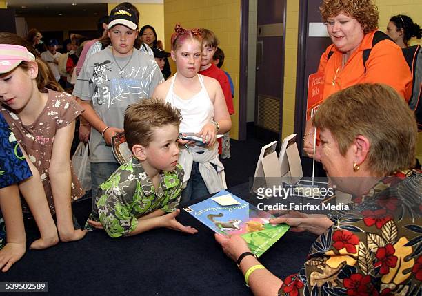 Kids go crazy for author Emily Rodda as they wait in line for her to sign copies of her new book in the Deltora Quest series at Homebush, 26...