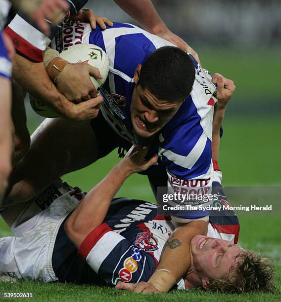 Bulldogs Willie Mason pins down Brett Finch during the 2004 NRL Grand Final Roosters vs Bulldogs game at Telstra Stadium, 3 October 2004. SMH Picture...