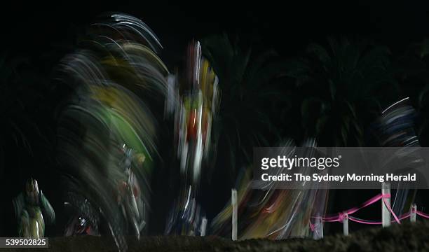 Blur of motion as competitors navigate the undulating terrain during competition at the Supercross Masters Grand Final held at a packed Central Coast...