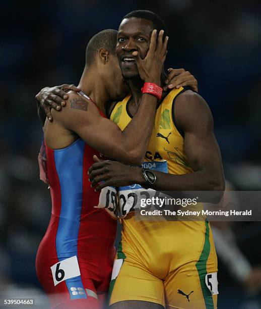 Olympic athlete Felix Sanchez wins the 400m hurdles and celebrates with fellow athlete Danny McFarlane at the 2004 Athens Olympic Games on 26 August...