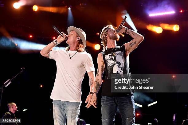 Musicians Tyler Hubbard and Brian Kelley of Florida Georgia Line perform onstage during 2016 CMA Festival - Day 3 at Nissan Stadium on June 11, 2016...