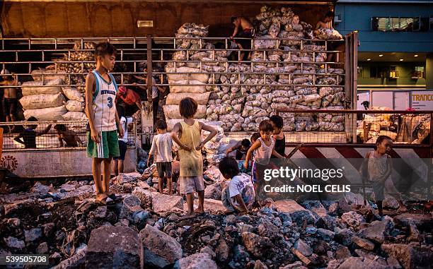 In this picture taken on June 8 children play in Divisoria market in Manila. Since winning the presidential election Rodrigo Duterte has said he will...