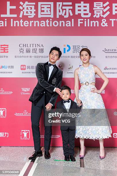 Actress Liu Yifei and actor Yang Yang arrive for the red carpet of the 19th Shanghai International Film Festival at Shanghai Grand Theatre on June...