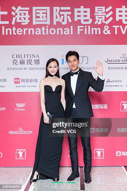 Actress Tang Yan and actor Lee Min-ho arrive for the red carpet of the 19th Shanghai International Film Festival at Shanghai Grand Theatre on June...