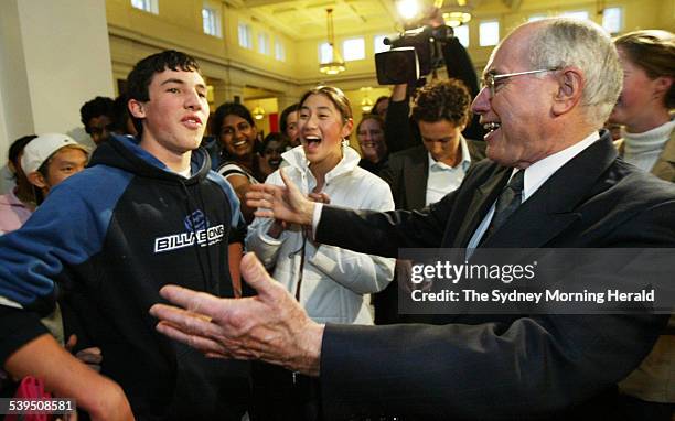 Prime Minister John Howard laughing at Girraween High School student Brett Buhagiar who accused the PM of ignoring him, in Old Parliament House where...