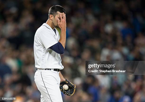 Relief pitcher Steve Cishek of the Seattle Mariners reacts after giving up home run to Prince Fielder of the Texas Rangers and blowing a save...